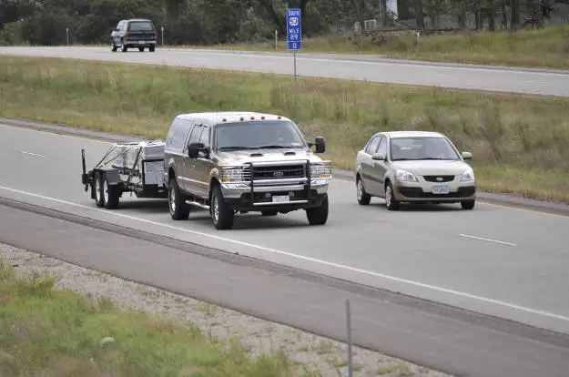 Car Passing Truck Towing Trailer Car Passing Truck Towing Trailer