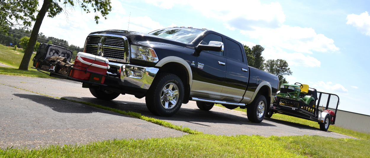 CURT front hitch with cargo carrier on truck towing trailer CURT front hitch with cargo carrier on truck towing trailer
