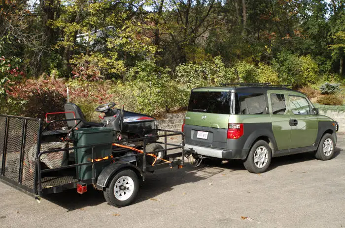 SUV Towing Small Landscape Utility Trailer SUV Towing Small Landscape Utility Trailer