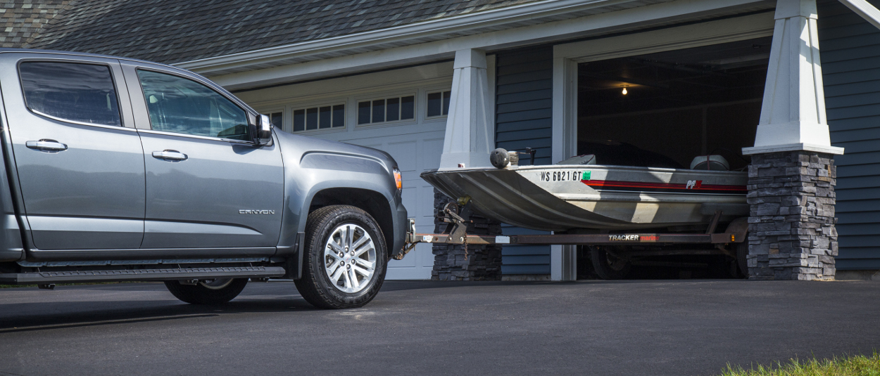 Truck with CURT front hitch parking a boat trailer Truck with CURT front hitch parking a boat trailer