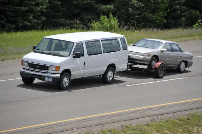Van with Tow Dolly Pulling Car Van with Tow Dolly Pulling Car
