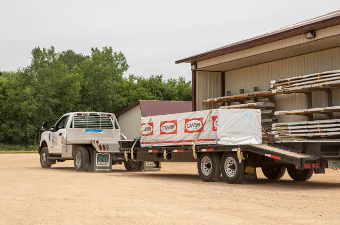 Work Truck Towing Large Flatbed Trailer Work Truck Towing Large Flatbed Trailer